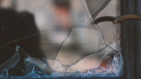 DOOR REFLECTED IN BROKEN GLASS Stock Footage 93398364