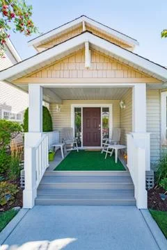 Door steps and concrete pathway leading to residential house entrance Stock Photos