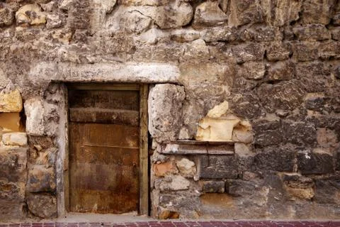 Door in the stone wall. Stock Photos