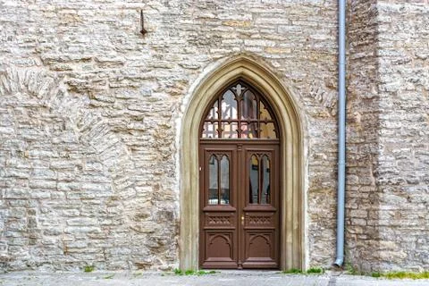Door in the stone wall. Stock Photos