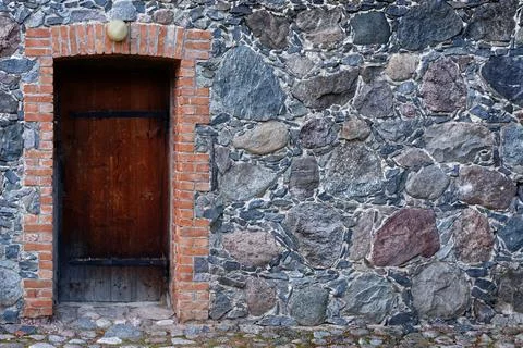 Door in a stone wall. Stock Photos