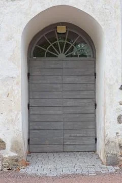 Door on stone wall. Stock Photos