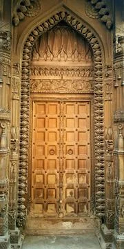 Door of a temple with complex carving Stock Photos