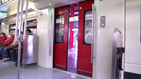 The door of the train open and some people board it Stock Footage 133469344