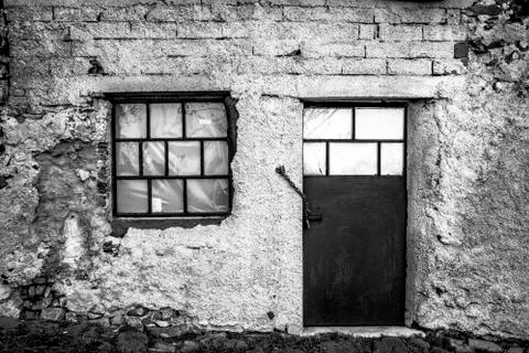 Door with window of an old barn Stock Photos