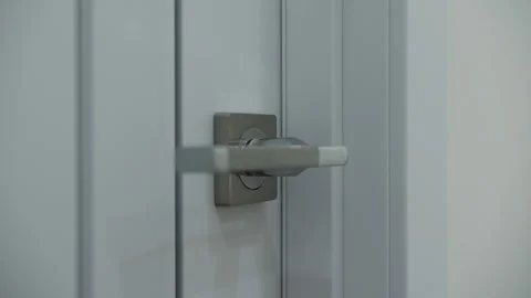Doorknob in a bright interior Stock Footage 265614570