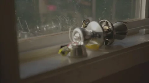 A doorknob on a window sill Stock Footage 103822890