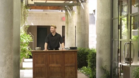 Doorman opening door for guests Video stock 83392439