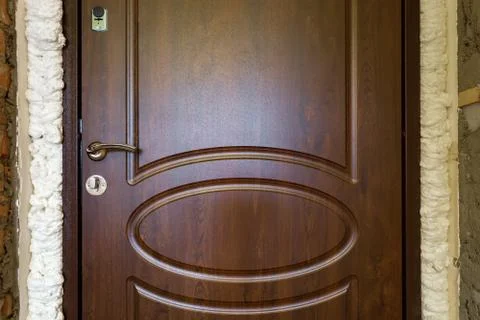 Doors installed in a brick wall with mounting foam Stock Photos