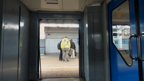The doors open and close in vestibule for youth people to travel indoors Stock Footage 246152657