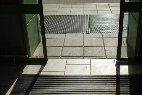 Doors open automatically. Opening door by motion sensor. Entrance to building Stock Photos