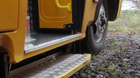 Doors of school bus closeing. Close up view of empty school bus on the parking Video stock 156346515