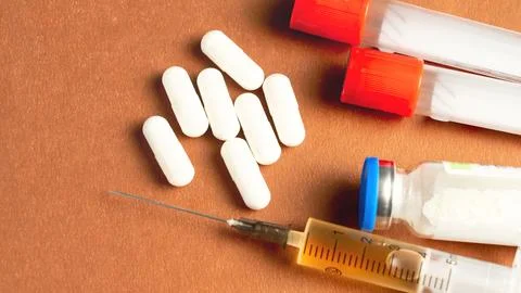 Doping test tubes. Two red tubes for two doping samples for the reliability of Stock Photos