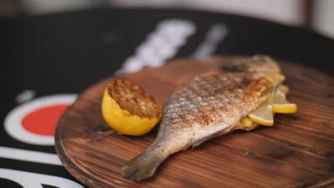 Dorado Fish Culinary Experience. Dorado Baked On A Grill With Spices And Herbs Stock Footage 274157355