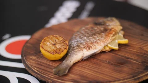 Dorado Fish Culinary Experience. Dorado Baked On A Grill With Spices Stock Footage 274157397
