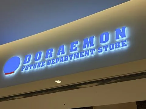 Doraemon Future Department Store glowing blue neon signage located near the.. Stockfoto's