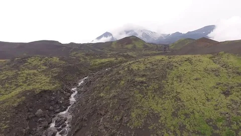 Dormant volcano. The river flows from the mountains Stock Footage 72653402
