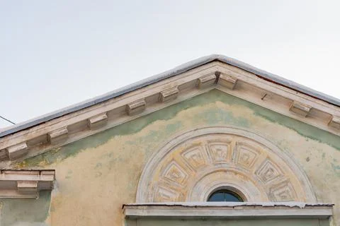 Dormer window with bas-relief Stock Photos