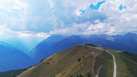 Doss del sabion summit and mountain chalet aerial view Video stock 342611548