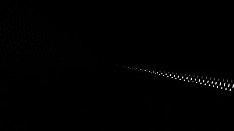 Dot lights shine in a dark space creating a pattern on the Stock Footage 339366951
