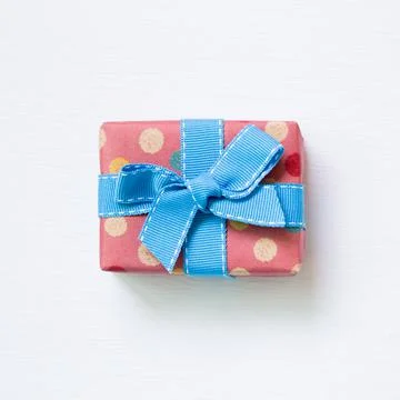 Dot pattern pink gift box isolated on white background Stock Photos