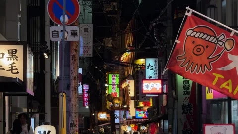 Dotonbori district of Osaka, Japan, featuring colorful neon signs at night Vídeos de archivo 345887911