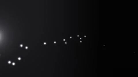 Dots drift across a dark field, illuminated by a subtle glow Stock Footage 329302205