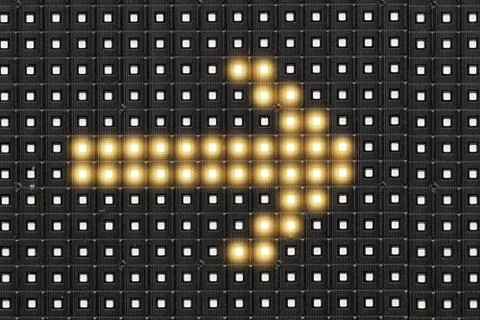 Dots matrix led diplay panel with illuminated symbol of arrow Stock Photos