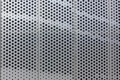Dots on a metal surface pattern texture background Fotos de archivo