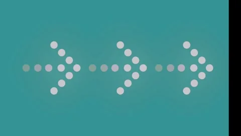 Dotted arrow icons pointing rightward displayed against solid teal background Stock Footage 346040773