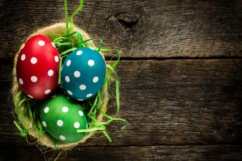 Dotted easter egg in basket Stock Photos