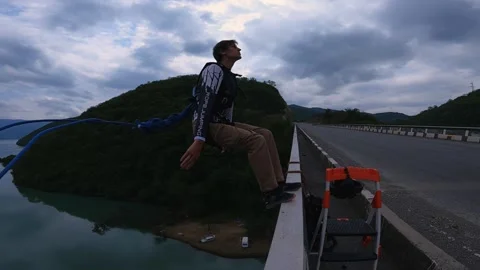 Double backflip bridge jump, crazy high jump, mountain bridge jump Stock Footage 221708994