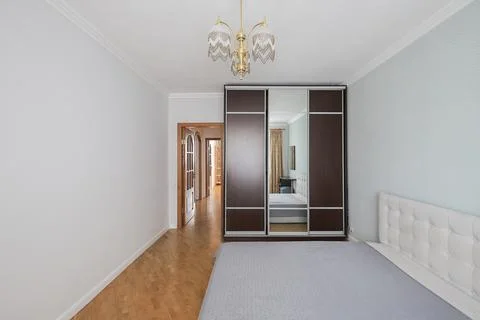 Double bed in the bedroom interior Фото