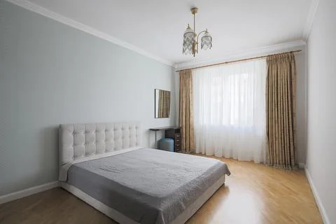 Double bed in the bedroom interior Stock Photos