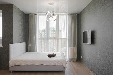 Double bed in the bedroom interior Stock Photos