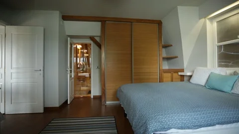 Double Bed In The Bedroom With A Large Wardrobe 스톡 동영상 94348808