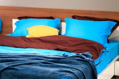 Double bed in the bedroom Stock Photos