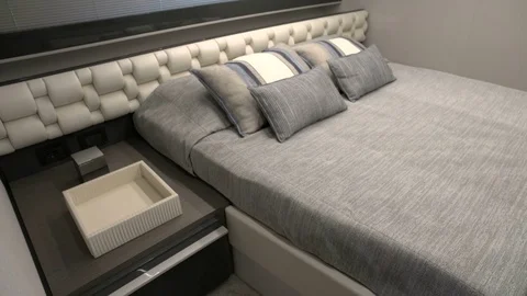 Double bed with bedside table on a yacht Stock Footage 72299268