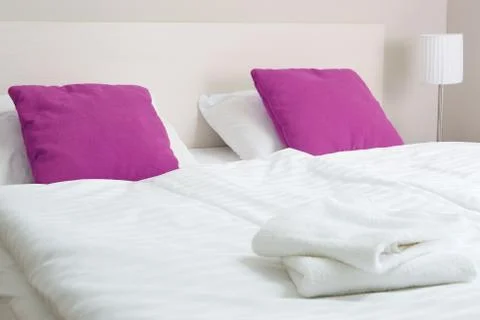 Double bed in hotel room. Accommodation. Stock Photos