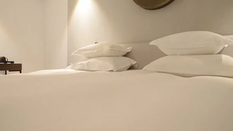 Double bed in a hotel room Stock Footage 105222961