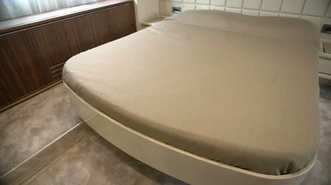 Double bed in main cabin on luxury yacht Stock Footage 58658260