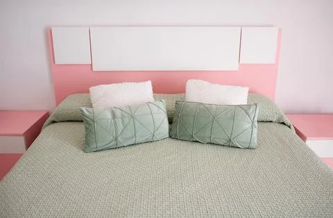 Double bed with pillows in interior of the modern bedroom Photos