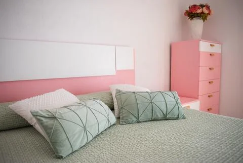 Double bed with pillows in interior Stock Photos