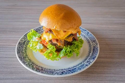 Double beef burger on plate served studio shot Foto stock