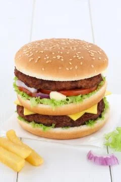Double burger hamburger copyspace copy space beef tomatoes lettuce cheese Stock Photos