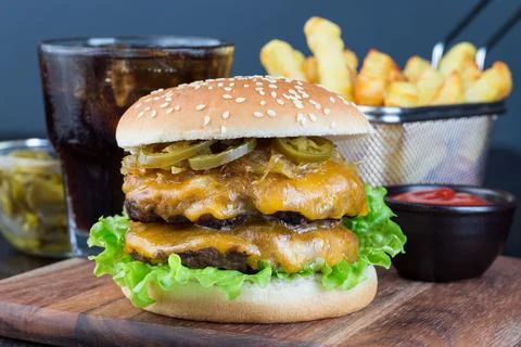 Double cheese burger with two beef patty, cheddar cheese, lettuce 스톡 사진