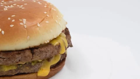 Double cheeseburger against gray background Stock Footage 276704690