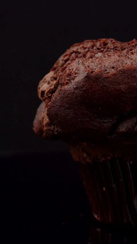 Double Chocolate Muffin with Chocolate Chunks Rotating on Dark Background Stock Footage 330517444