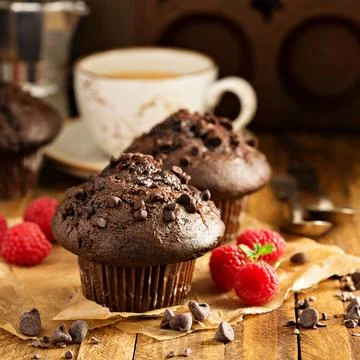 Double chocolate muffins with raspberry Stock Photos