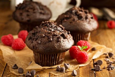 Double chocolate muffins with raspberry Stock Photos